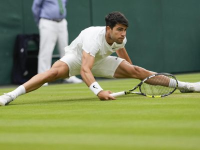 Carlos Alcaraz of Spain plays a forehand return to Ugo Humbert of France during their fourth round match at the Wimbledon tennis championships in London, Sunday, July 7, 2024. (AP Photo/Alberto Pezzali)